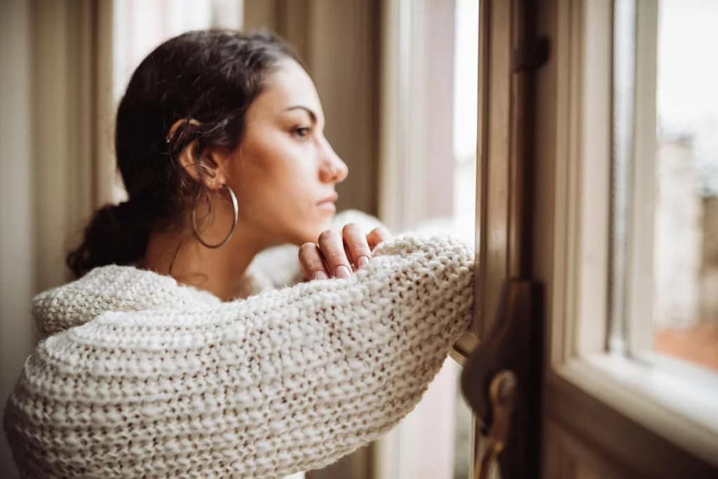 Stressed woman at window pcBPkU.width JJTNsk.jpg