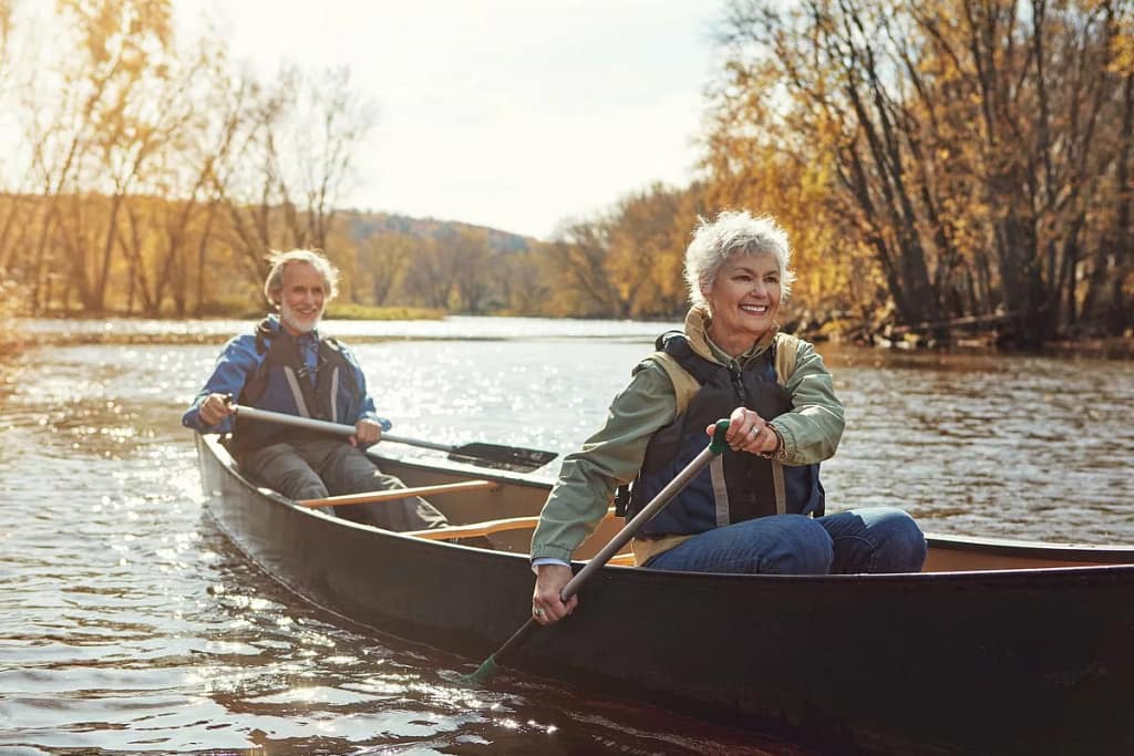 Mature couple rowing together in a canoe aaF.width .jpg