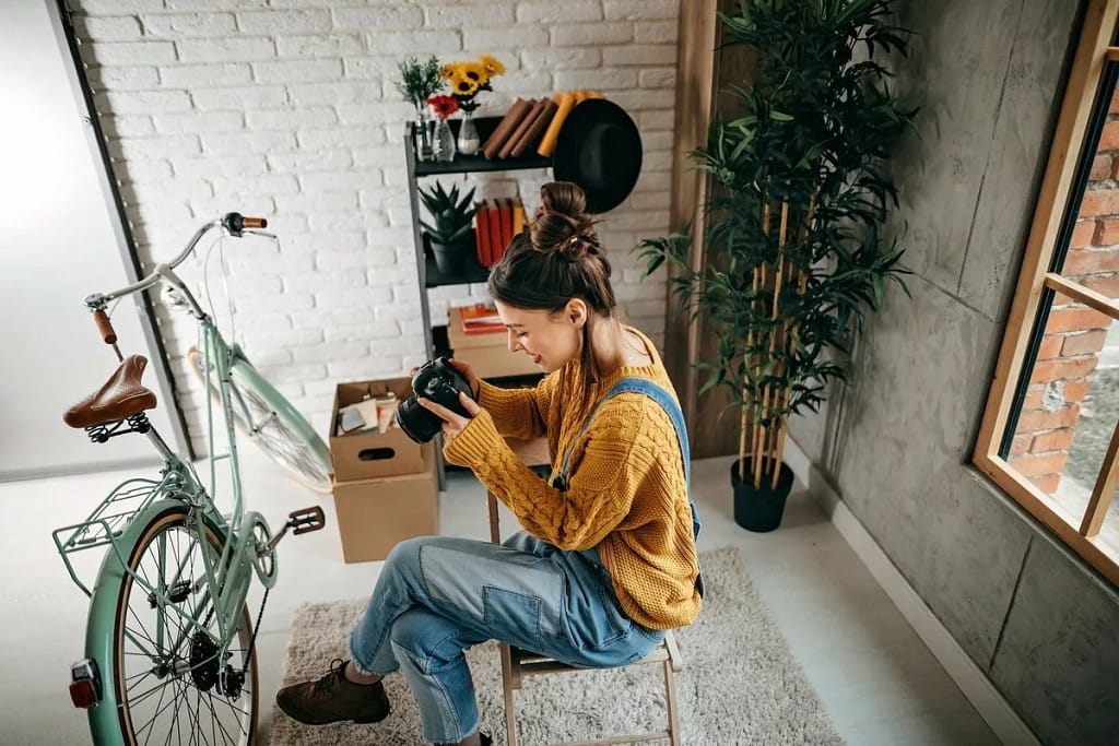 woman with camera and bike inside.width .jpg