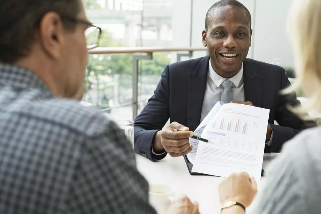 mature couple talking to financial advisor PO.width CEYgc.jpg
