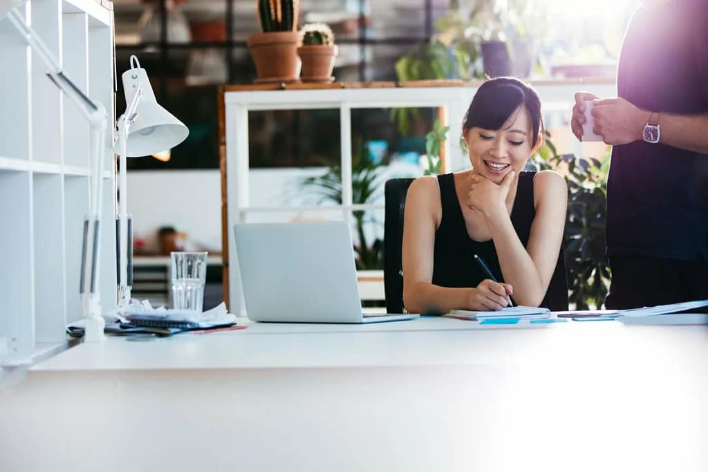 Woman working in office CmcykUG.width .jpg