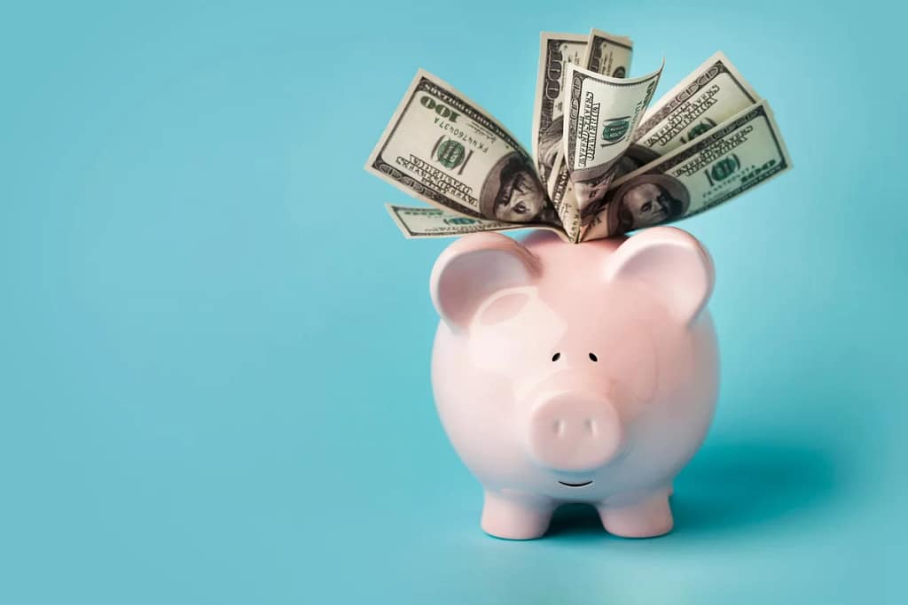 gettyimages overstuffed piggy bank.jpeg