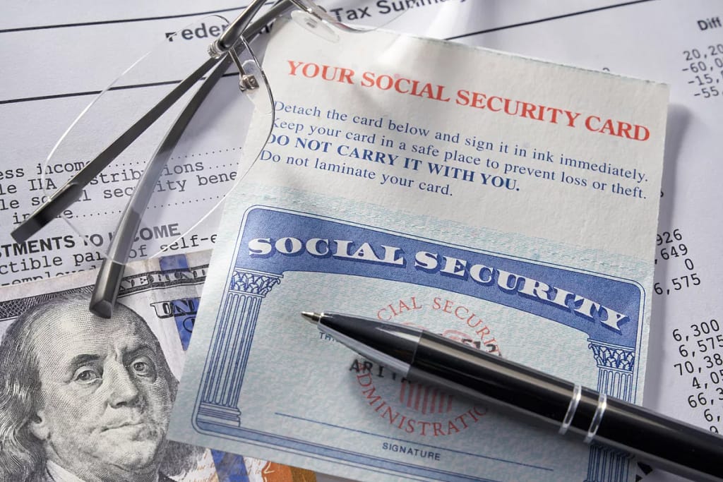gettyimages social security glasses hundred dollar bill.jpeg