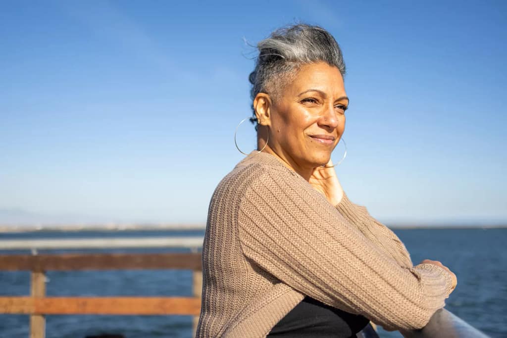 smiling person looking out over the ocean.jpg