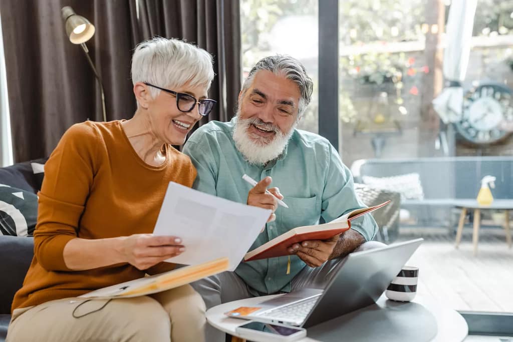 excited couple looking at document together.jpg