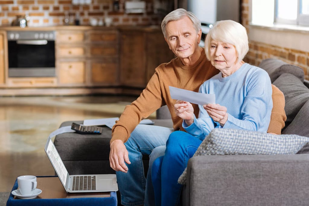 older couple with check .jpg