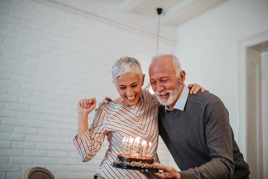 senior couple birthday cake gettyimages .jpg