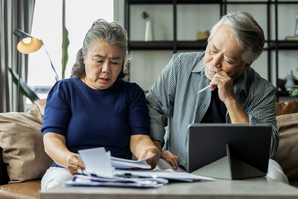 older asian couple stressed.jpg