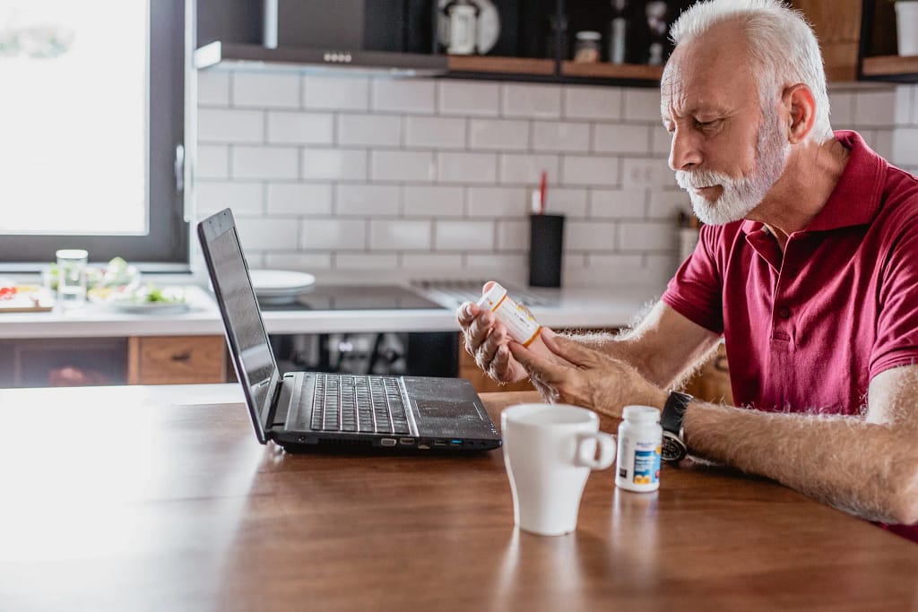 older man pills laptop.jpg