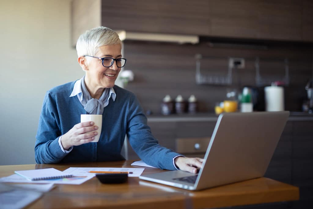 retired woman investing laptop k ira.jpg
