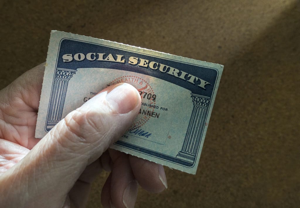 social security card benefit check cola recipient getty.jpg