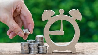 gettyimages coins and clock PfCM