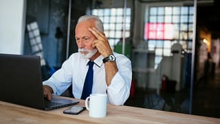 older man laptop serious gettyimages JjIG