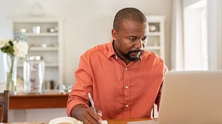 middle aged man at laptop gettyimages rFfN