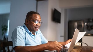 older man at laptop gettyimages