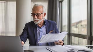 older man professional laptop gettyimages wnN