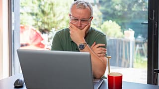 man s laptop by window gettyimages