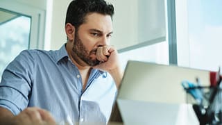 man in s desk serious nervous gettyimages