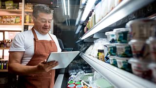 older man food counter ettyimages