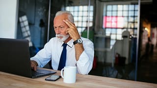 older man laptop serious gettyimages
