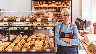 older woman bakery working gettyimages