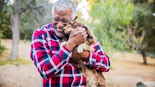 retired senior with his dog