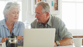 senior couple laptop serious gettyimages