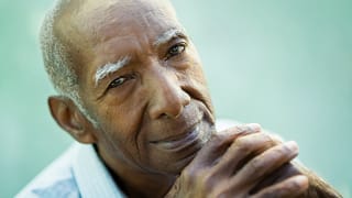 senior staring at camera while pondering getty