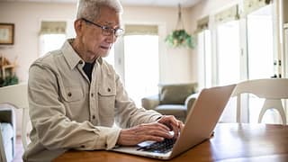 typing on laptop