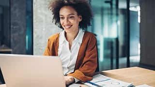 woman s smiling laptop gettyimages
