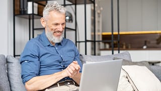 a person looking at a laptop