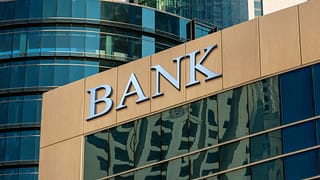 bank sign on glass wall of business center