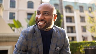 dapper person smiling looking away