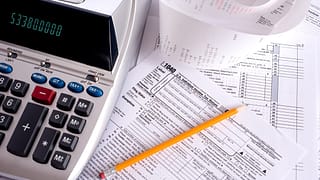 gettyimages adding machine taxes