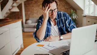 man mid aged laptop stressed