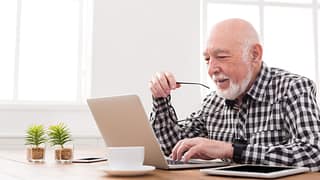 older man at laptop gettyimages