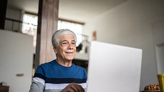 senior laptop smiling gettyimages