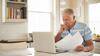 senior man laptop stressed gettyimages