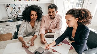 Couple discuss finances with lender PIDvJe.width