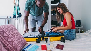 Couple packing for vacation lrtJl.width .jpg