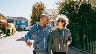 Couple walking in neighborhood of gated commu.width SuvQq.jpg
