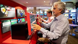 People partaking in sports gambling XSaswb.width