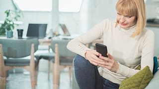 Woman uncomfortable by what shes reading on h.width InPJRqv