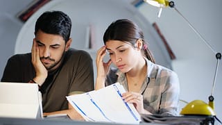 Young couple sad bills.width .jpg