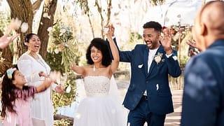 bride and groom cheering at wedding arpIRny.width