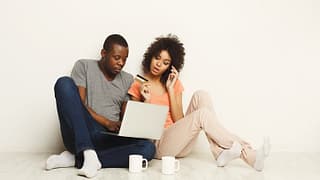 couple with laptop and credit card ZBP.width