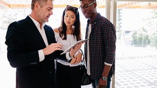 couple with realtor in house.width
