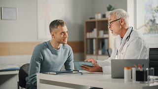 doctor talking to male patient s gettyimages