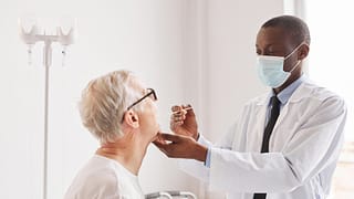 doctor treating patient