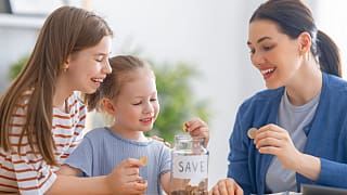 family saving money kids piggybank
